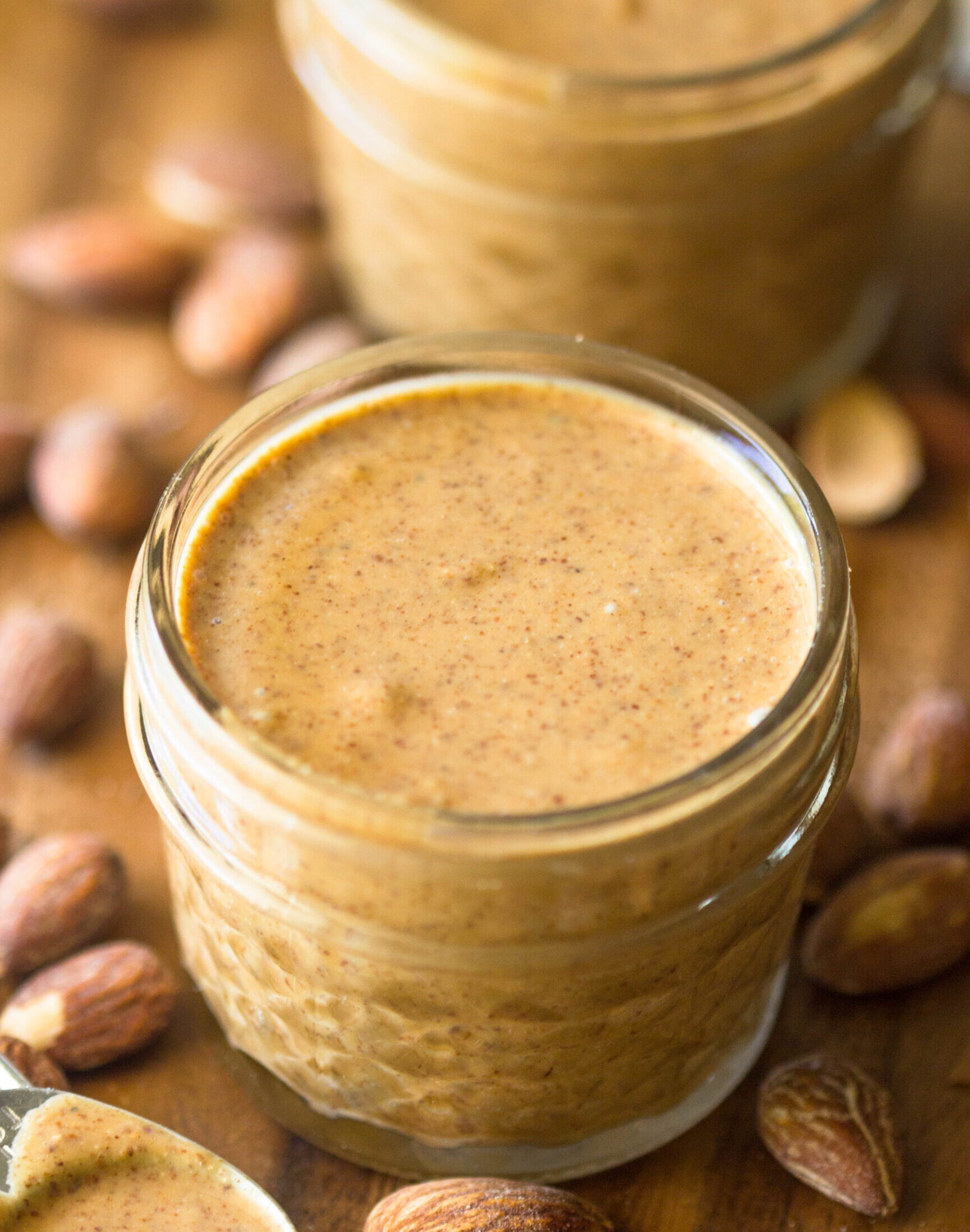 A photo of almond butter in mason jars.