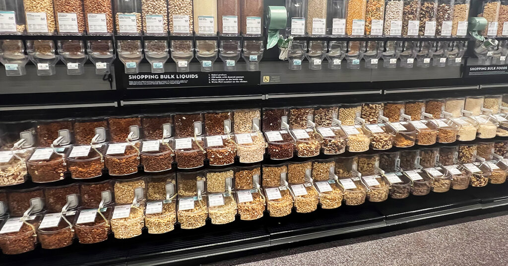 gravity dispensers and scoop bins in a grocery store